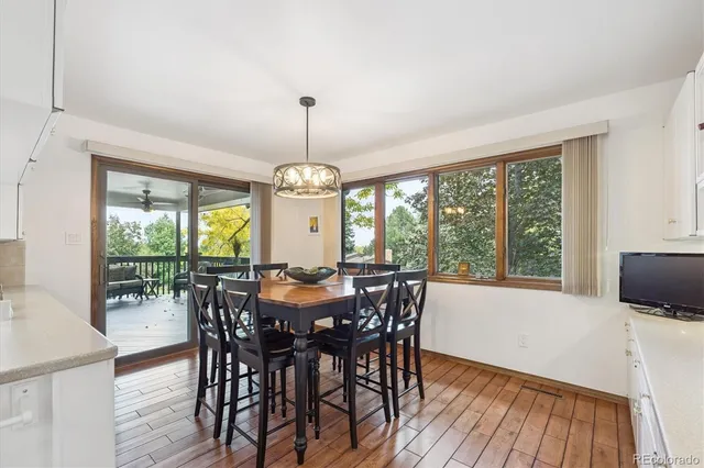 a view of a dining room with furniture window and wooden floor