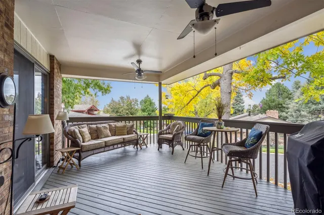 swimming outdoor living room with furniture and a large window