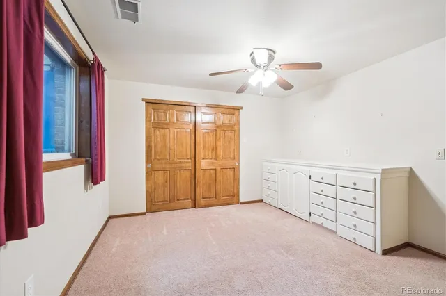 a bathroom with a sink toilet vanity and shower