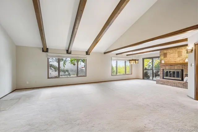 an empty room with windows and an empty room