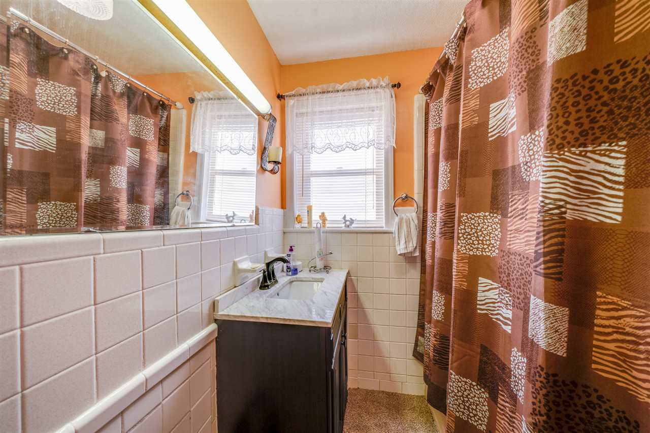720 Bayard Road Durham, NC 27703 - Photo 15 of 28 a bathroom with a sink and a shower