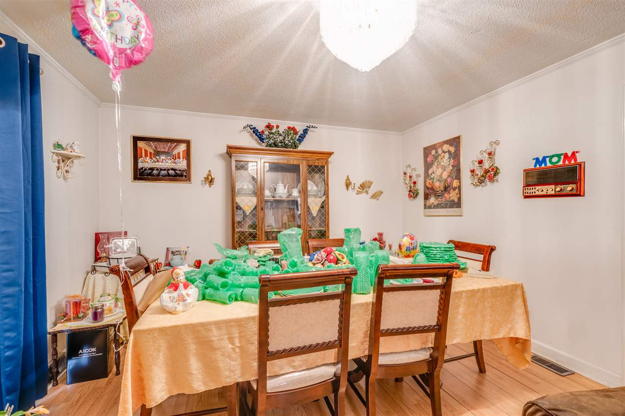 720 Bayard Road Durham, NC 27703 - Photo 9 of 28 a dining room with furniture and wooden floor