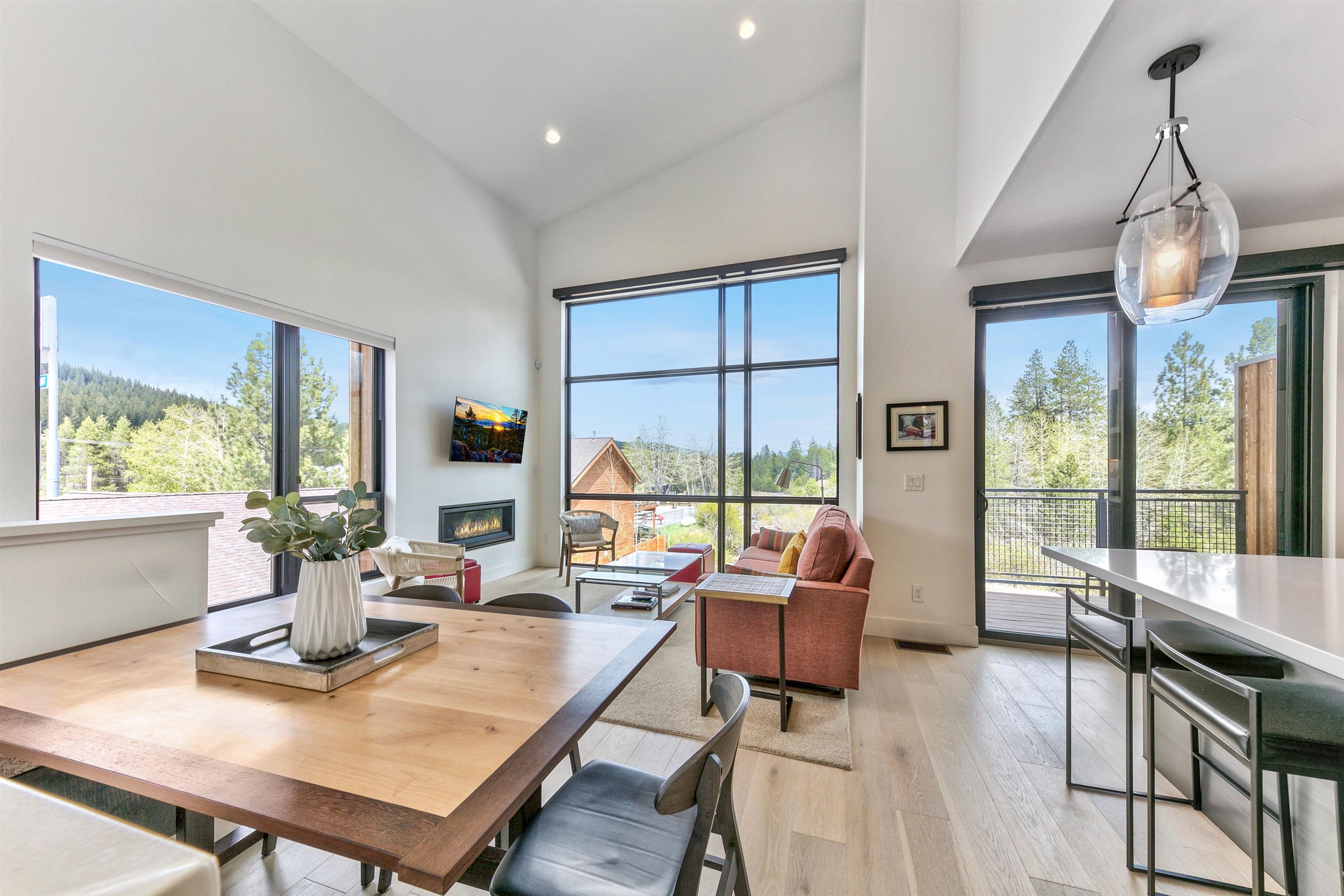 12869 Ice House Loop Truckee, CA 96161 - Photo 14 of 21 a living room with fireplace furniture and a large window