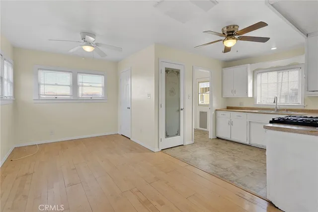 a view of a kitchen with a sink and cabinet area