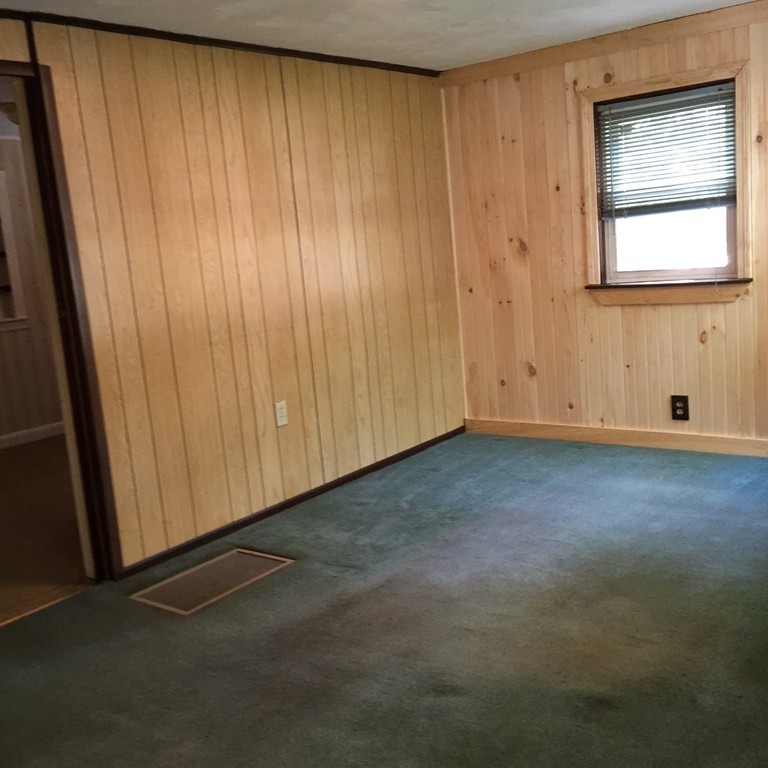 10 Hemlock Road Holbrook, MA 02343 - Photo 2 of 13 a view of an empty room with a window