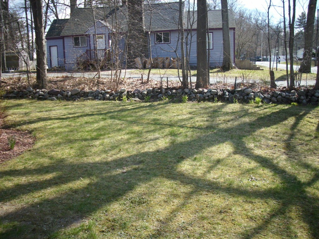 10 Hemlock Road Holbrook, MA 02343 - Photo 10 of 13 a view of a house with a yard