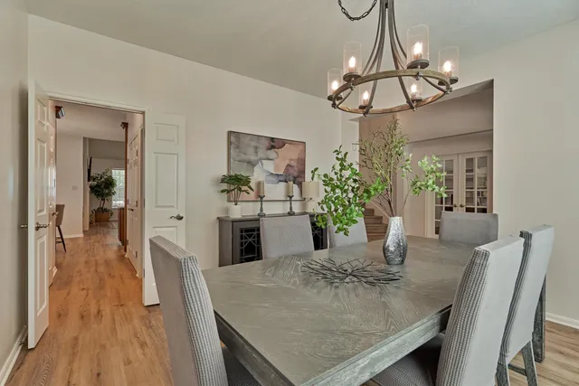 a view of a dining room with furniture and wooden floor