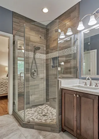 a bathroom with a shower and a sink