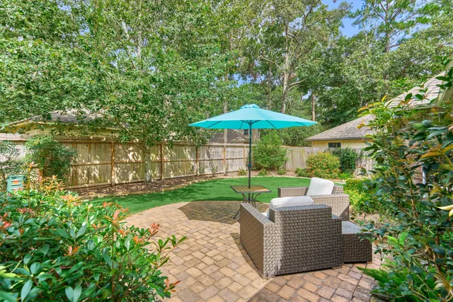 a view of a house with backyard porch and sitting area