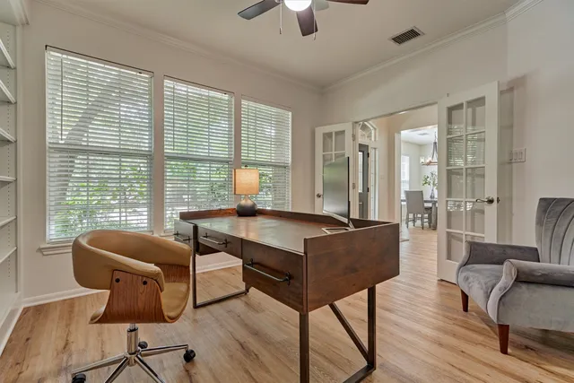 a living room with furniture and a floor to ceiling window