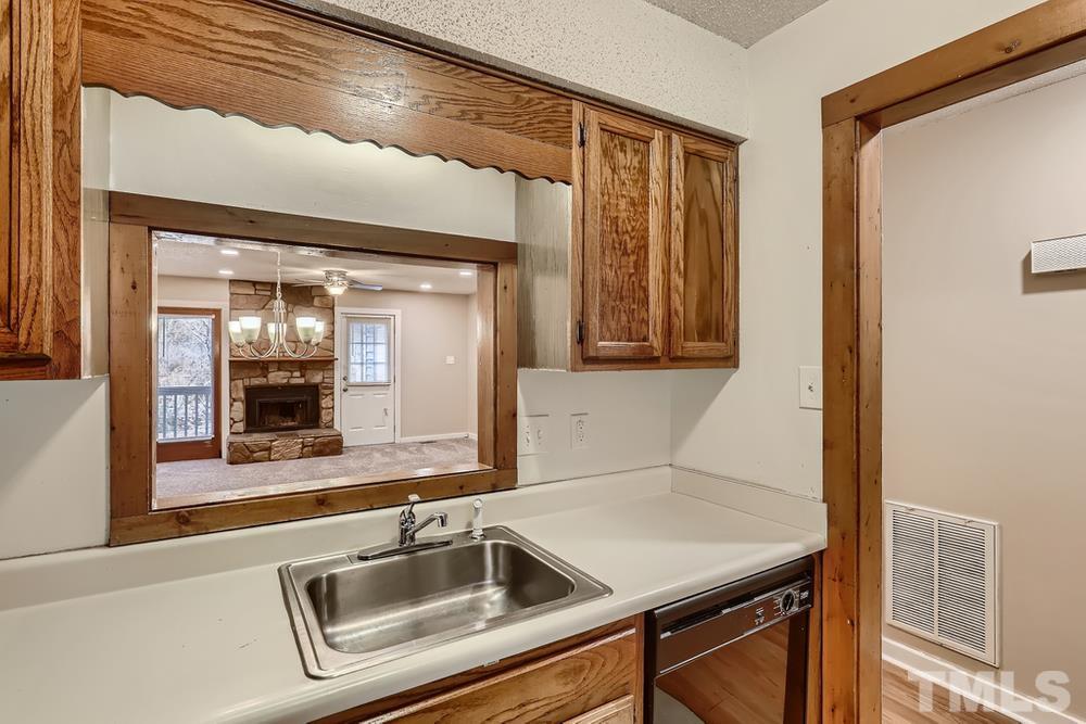 5604 Thea Lane, Unit B Raleigh, NC 27606 - Photo 12 of 27 a bathroom with a sink and a mirror