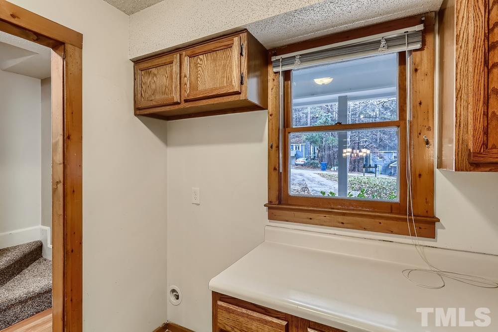 5604 Thea Lane, Unit B Raleigh, NC 27606 - Photo 13 of 27 a bathroom with a bathtub and a window