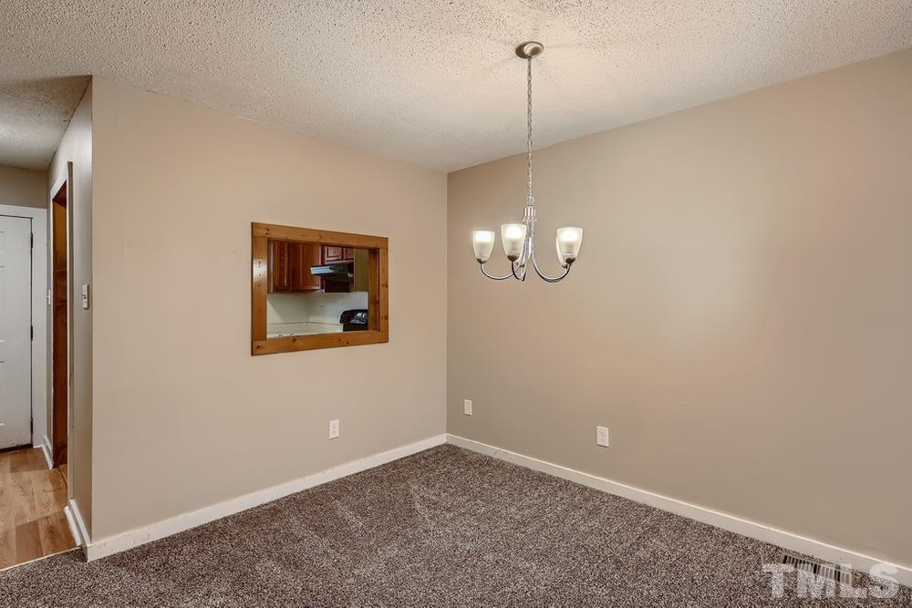 5604 Thea Lane, Unit B Raleigh, NC 27606 - Photo 14 of 27 a view of an empty room with a window
