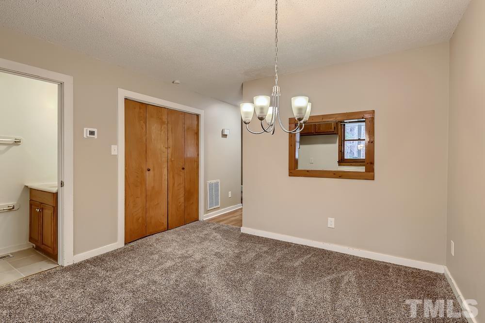 5604 Thea Lane, Unit B Raleigh, NC 27606 - Photo 15 of 27 a view of a chandelier in a room