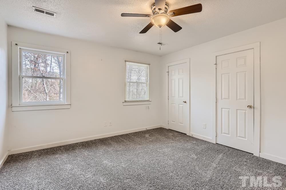 5604 Thea Lane, Unit B Raleigh, NC 27606 - Photo 18 of 27 a view of an empty room with a window