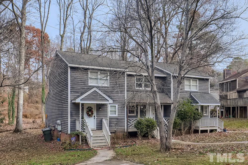 5604 Thea Lane, Unit B Raleigh, NC 27606 - Photo 3 of 27 a front view of a house with garden