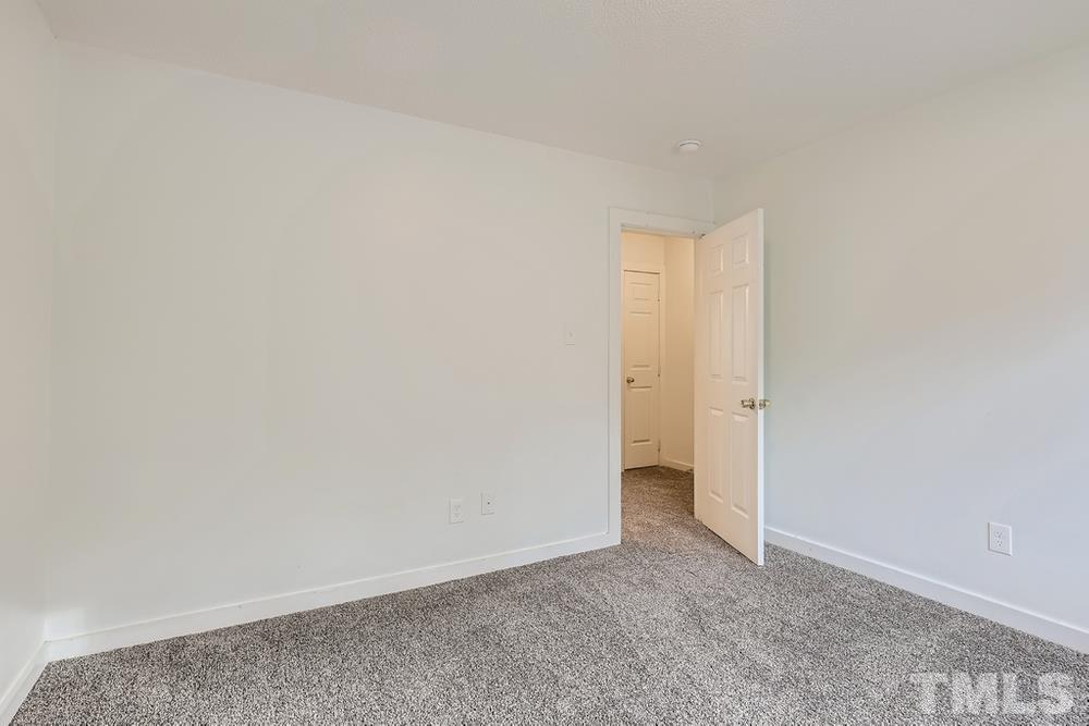 5604 Thea Lane, Unit B Raleigh, NC 27606 - Photo 21 of 27 a view of an empty room