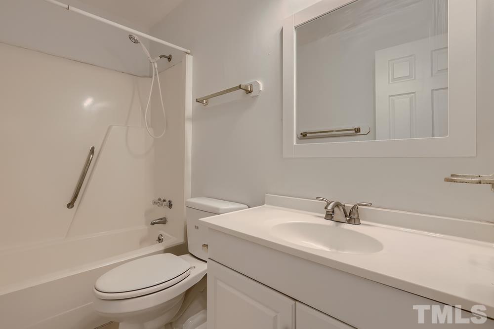 5604 Thea Lane, Unit B Raleigh, NC 27606 - Photo 22 of 27 a bathroom with a sink toilet and shower
