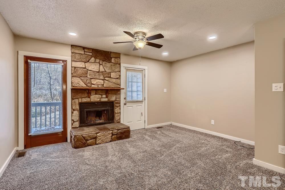 5604 Thea Lane, Unit B Raleigh, NC 27606 - Photo 6 of 27 a view of a livingroom with a fireplace