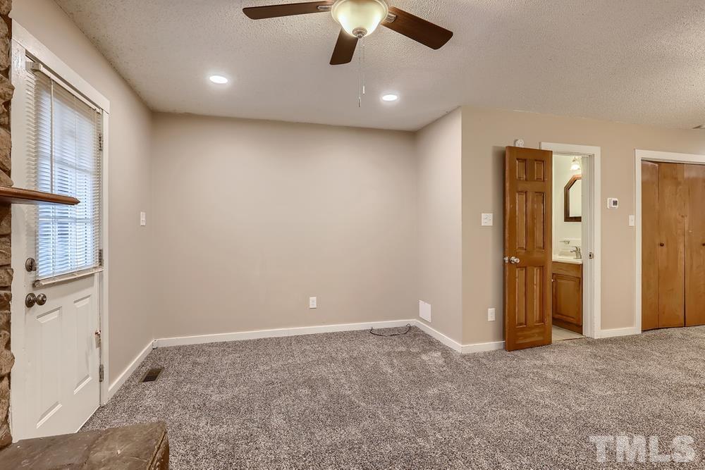 5604 Thea Lane, Unit B Raleigh, NC 27606 - Photo 7 of 27 a view of an empty room and chandelier fan