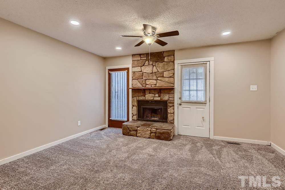 5604 Thea Lane, Unit B Raleigh, NC 27606 - Photo 9 of 27 a view of a livingroom with a fireplace
