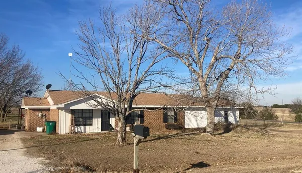 a view of a house with a snow in front of it