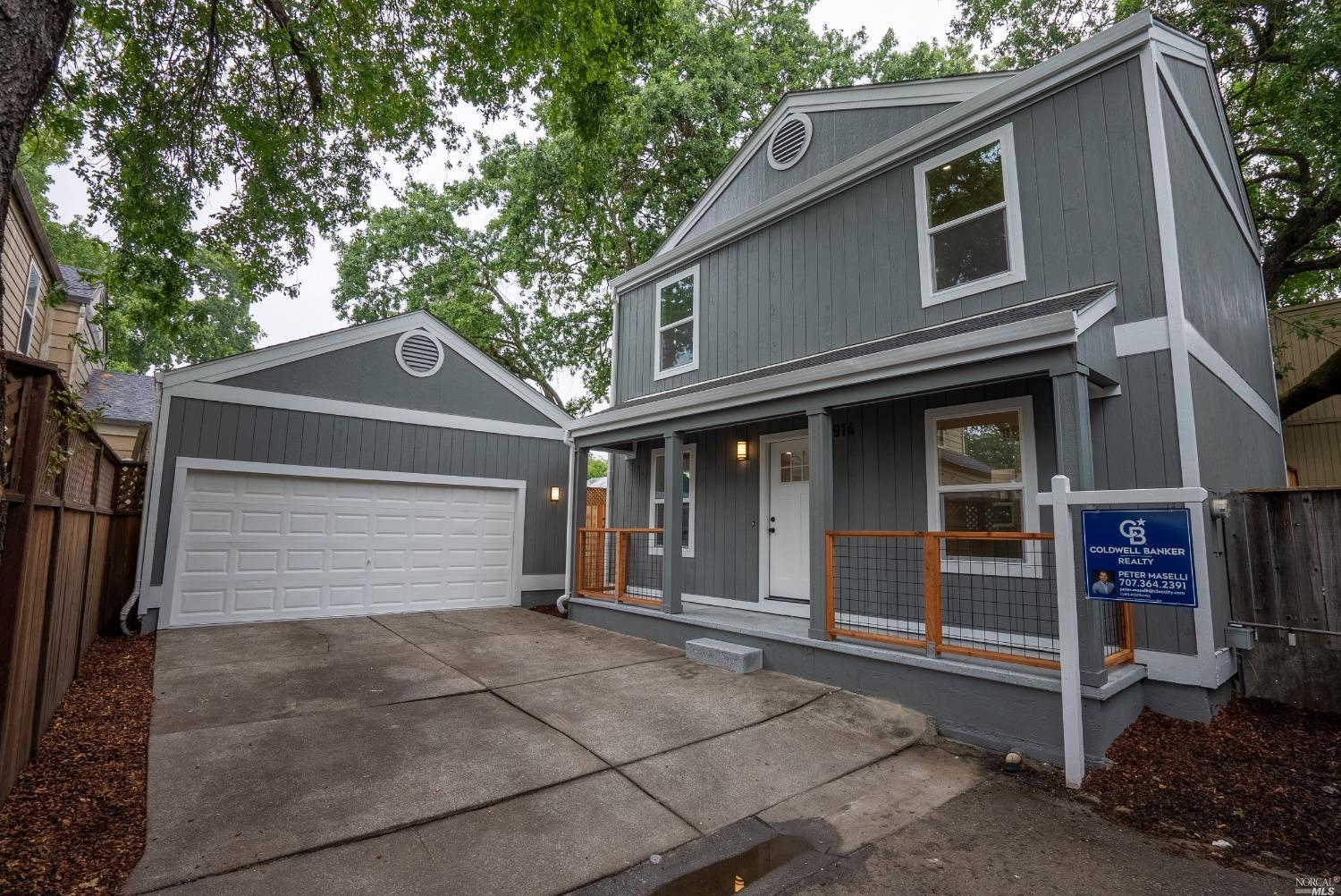 a front view of a house with a garage