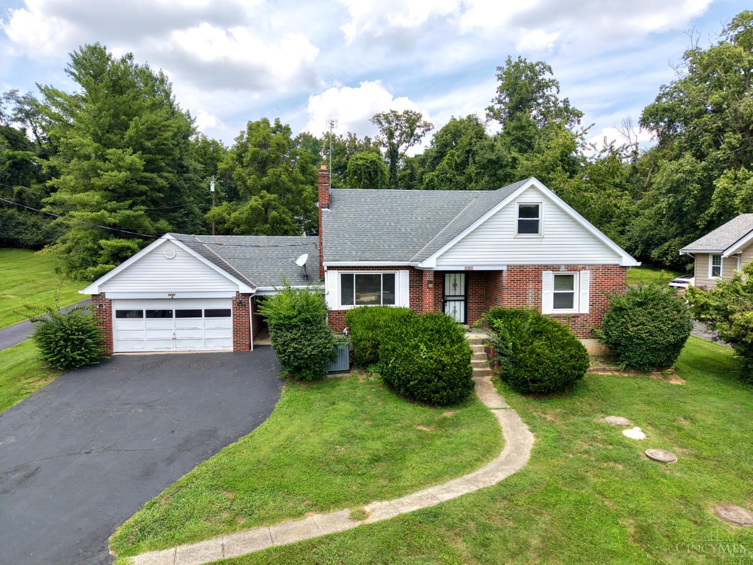 8240 Camargo Road Madeira, OH 45243 - Photo 1 of 33 Charming brick Cape Cod just minutes from downtown Madeira, situated on a rare nearly half-acre lot.