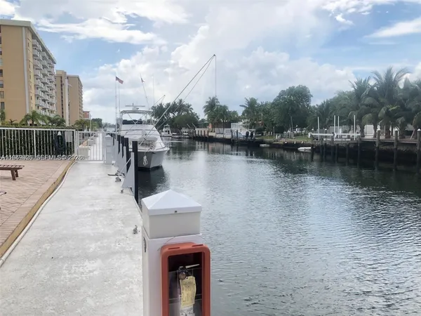 a swimming pool with outdoor seating and yard