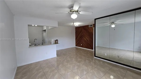 a view of a bathroom with a bathtub and shower