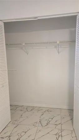 a view of an empty walk in closet