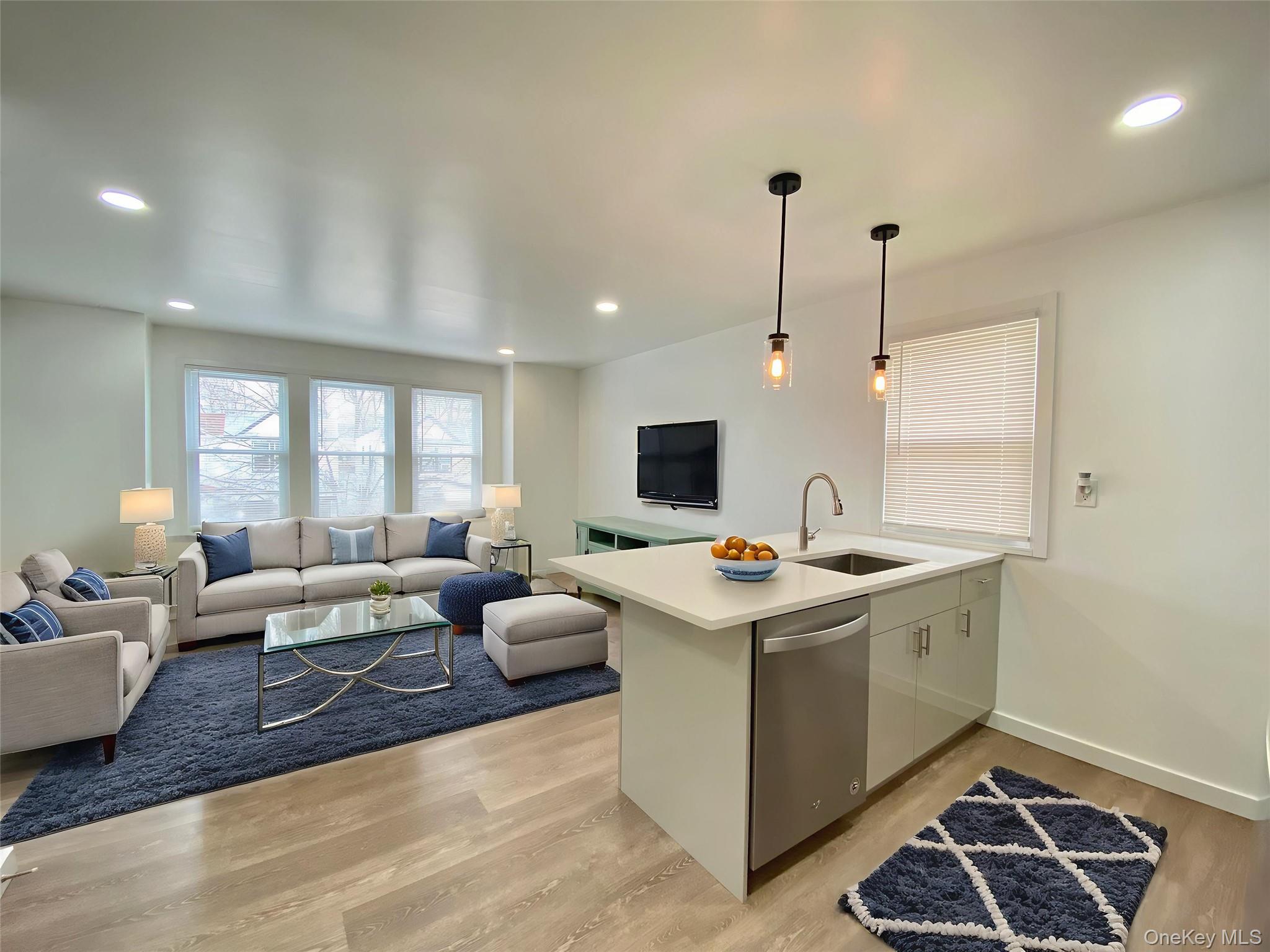 69-14 66th Street, Unit 2 Queens, NY 11385 - Photo 2 of 2 a view of living room with furniture and a flat screen tv