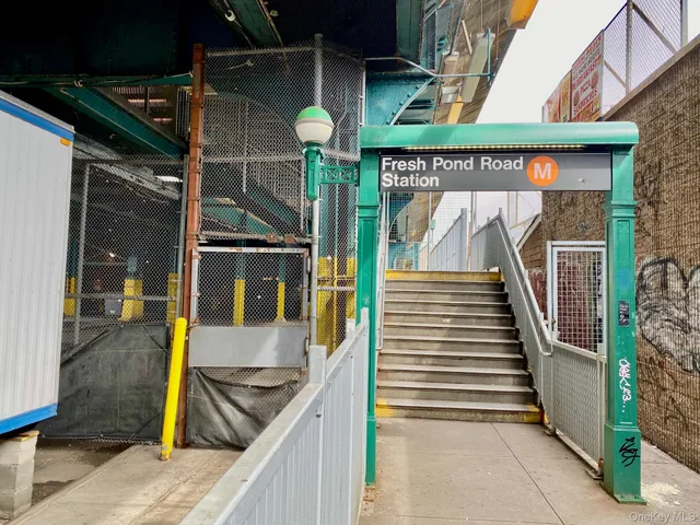 a bedroom with a bed and a potted plant