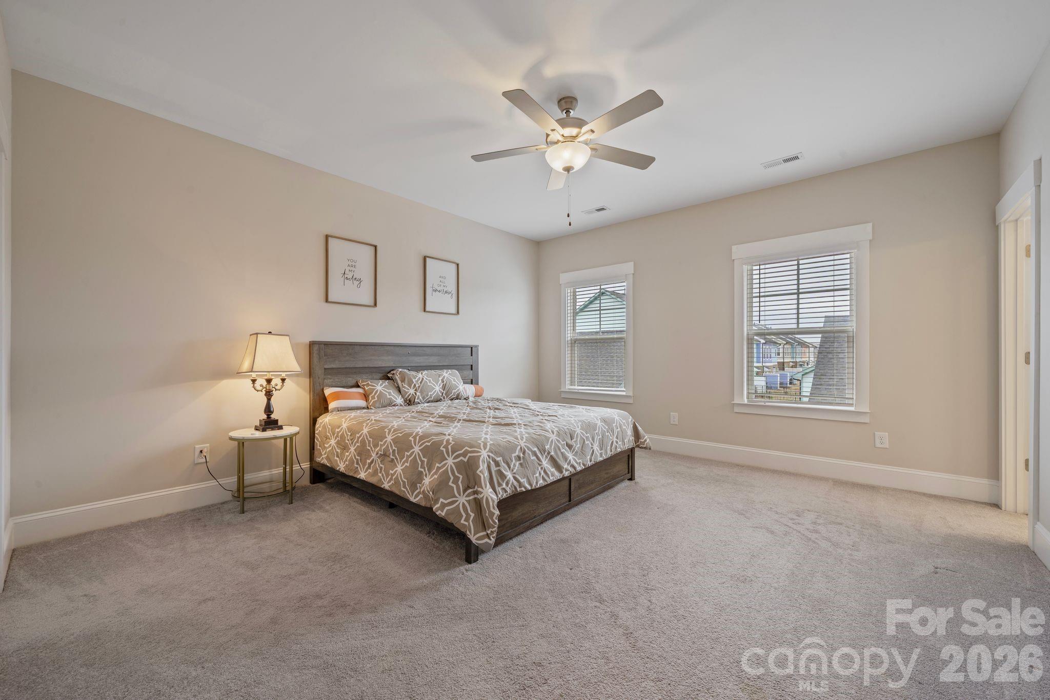 684 Dunkins Ferry Road Rock Hill, SC 29730 - Photo 12 of 32 a spacious bedroom with a bed and window