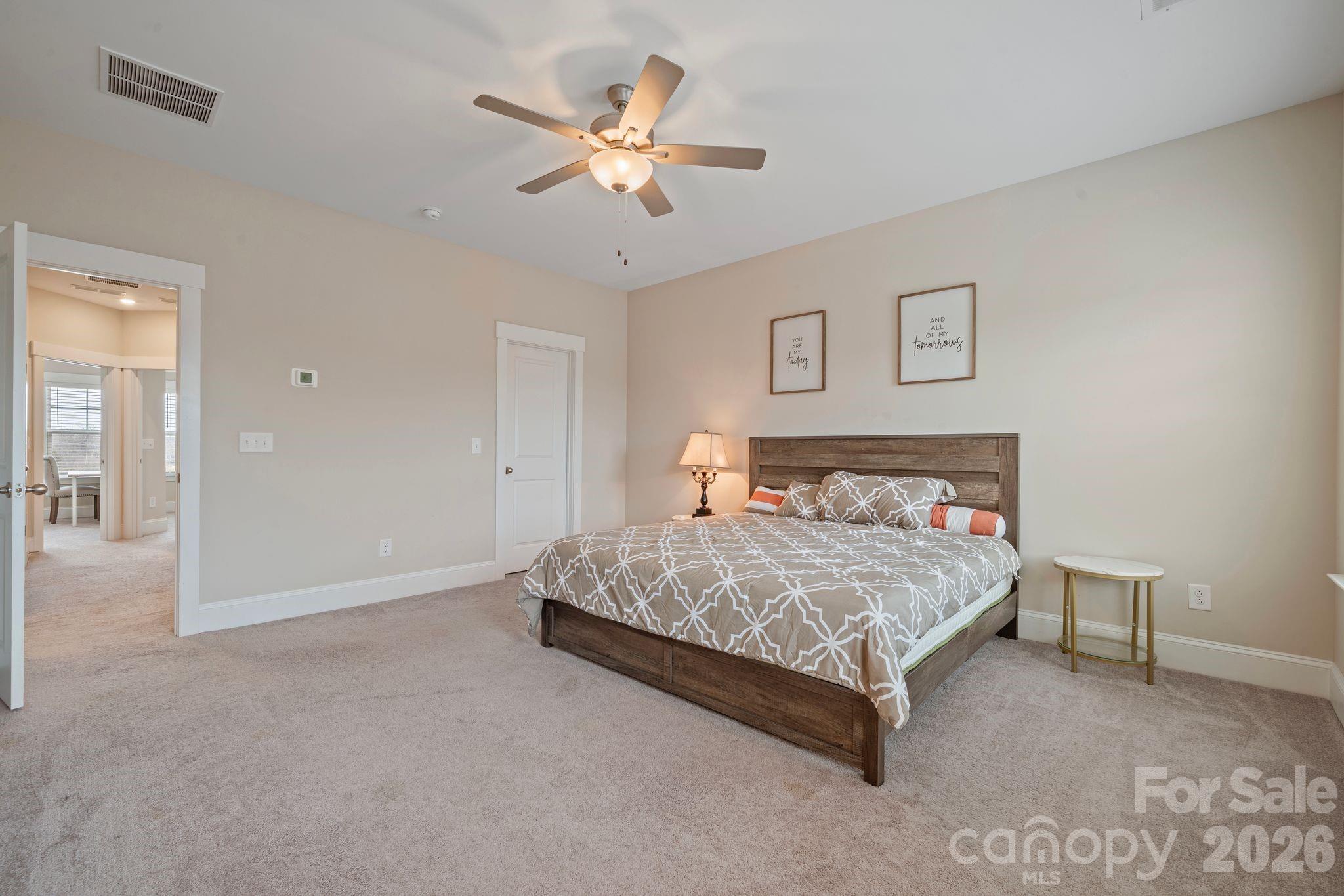 684 Dunkins Ferry Road Rock Hill, SC 29730 - Photo 13 of 32 a bedroom with a bed and a chandelier