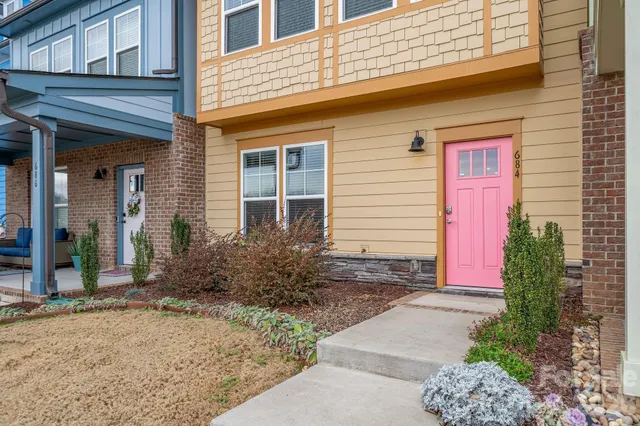 a front view of a house with garden