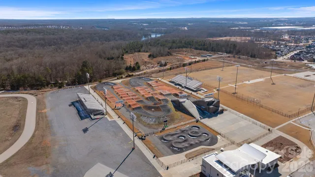 a front view of a residential apartment building with a yard