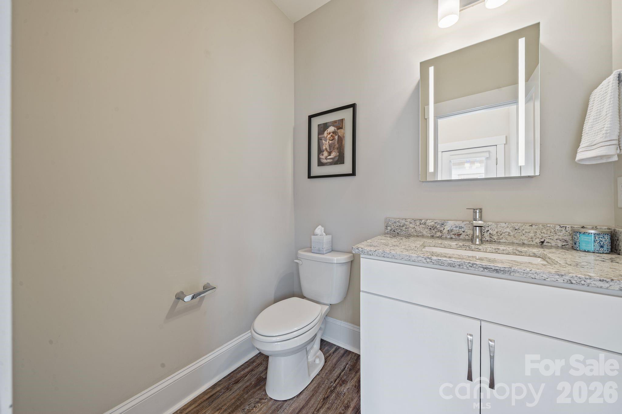 684 Dunkins Ferry Road Rock Hill, SC 29730 - Photo 10 of 32 a bathroom with a granite countertop toilet sink and mirror