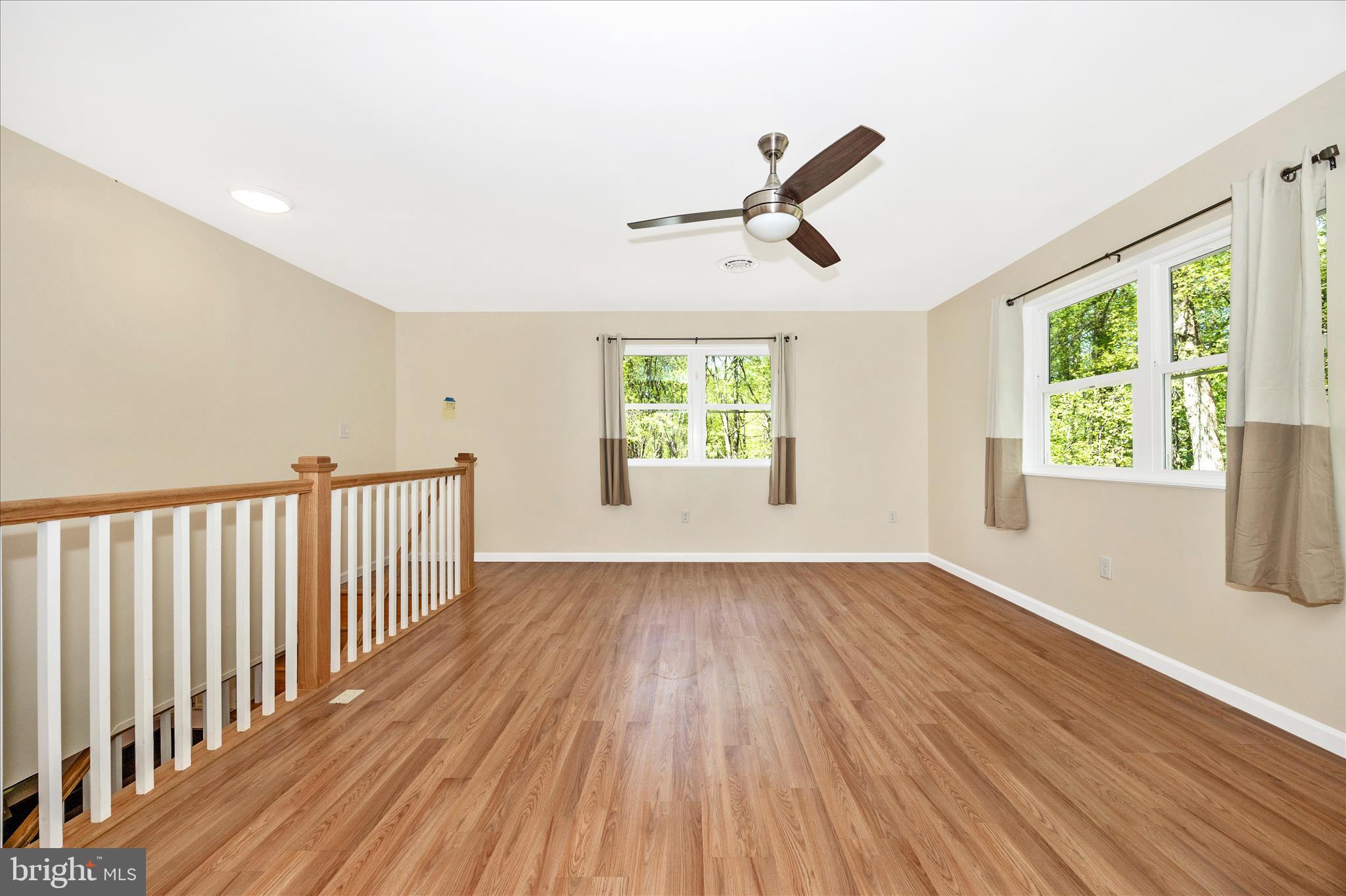 6518 Woodville Road Mount Airy, MD 21771 - Photo 25 of 53 wooden floor in an empty room with a window