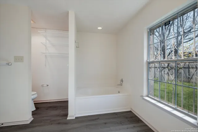 a bathroom with a bathtub and shower