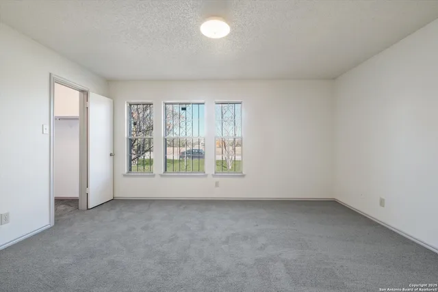 an empty room with a empty space and window