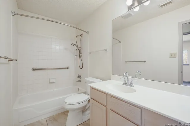a bathroom with a sink a toilet and a bathtub