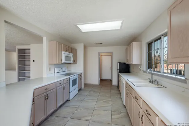 a large kitchen with a lot of counter space