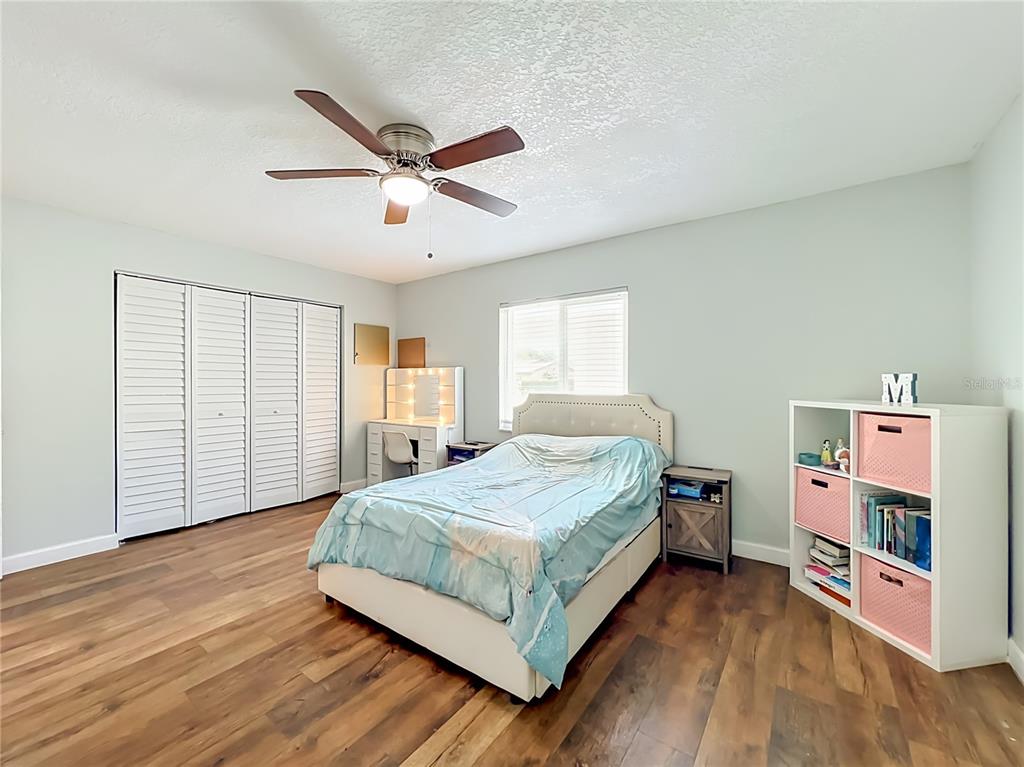 153 Variety Tree Circle Altamonte Springs, FL 32714 - Photo 28 of 44 a bedroom with a bed and a window