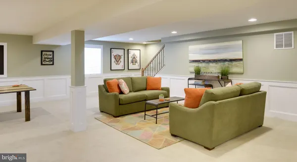 a kitchen with stainless steel appliances granite countertop a stove top oven a sink a dining table and chairs