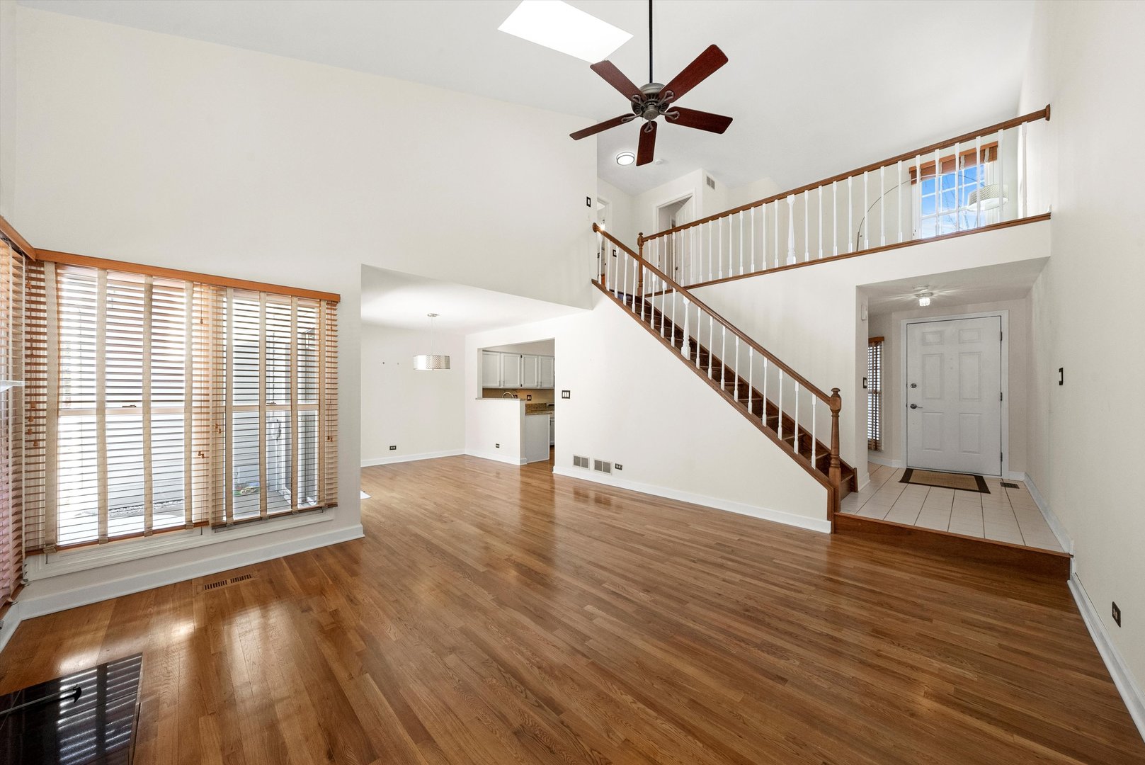 289 Ripplebrook Court Schaumburg, IL 60173 - Photo 16 of 31 a view of an empty room with wooden floor and a window