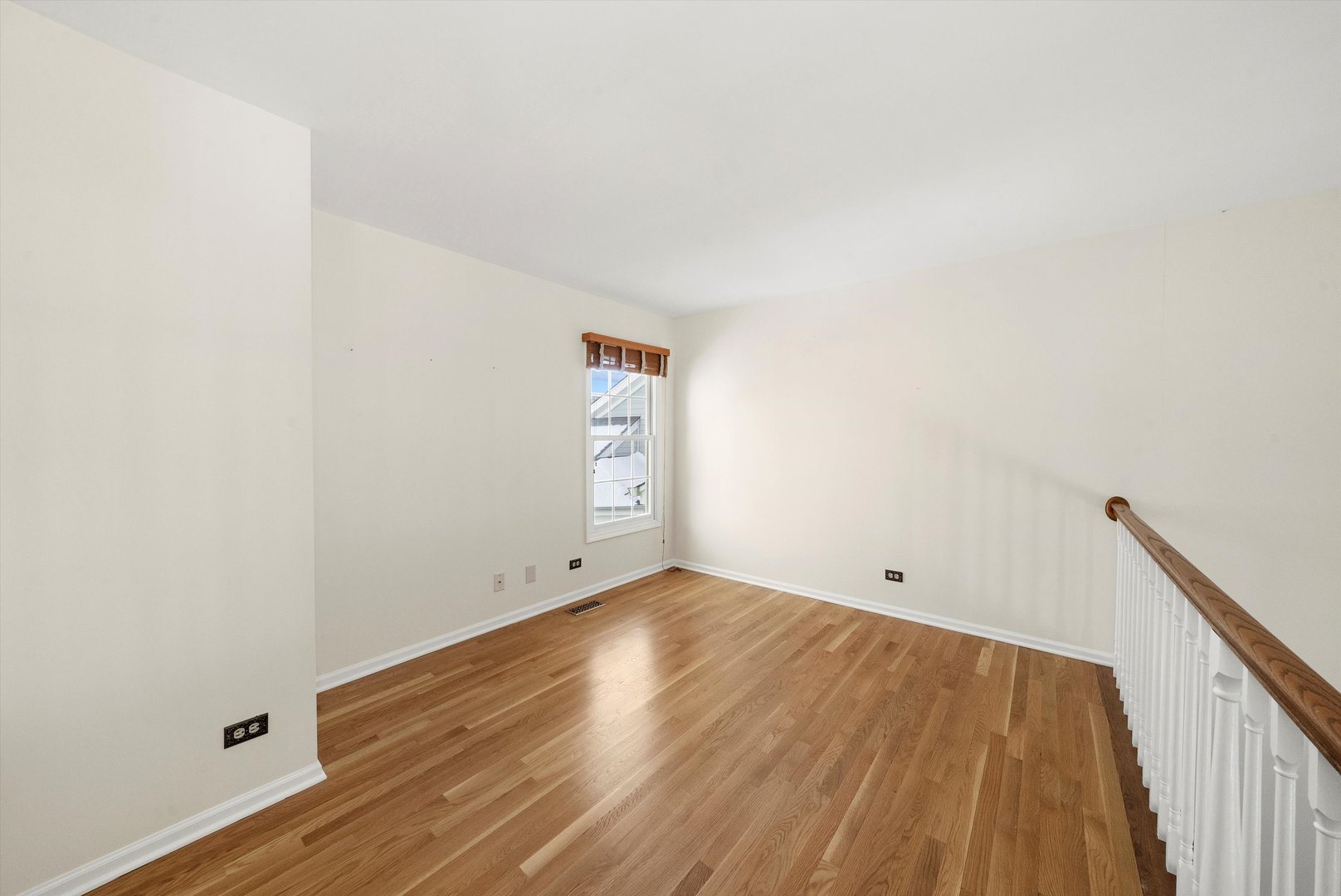 289 Ripplebrook Court Schaumburg, IL 60173 - Photo 20 of 31 an empty room with wooden floor and windows