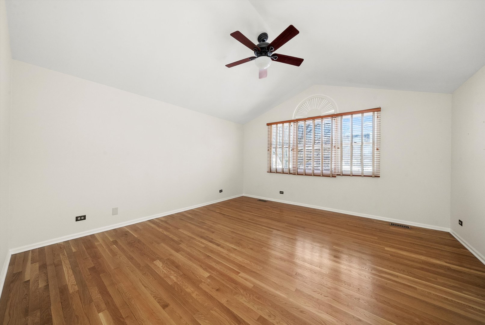 289 Ripplebrook Court Schaumburg, IL 60173 - Photo 24 of 31 wooden floor in an empty room with a window