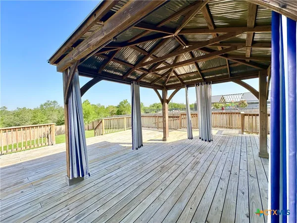 a view of porch with wooden floor