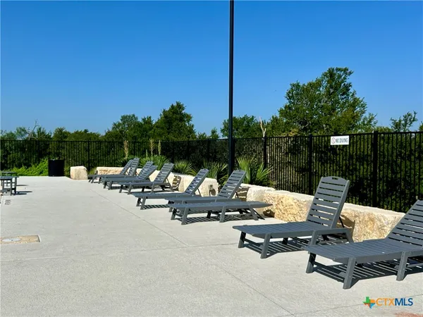 a view of a patio with a chairs and couch